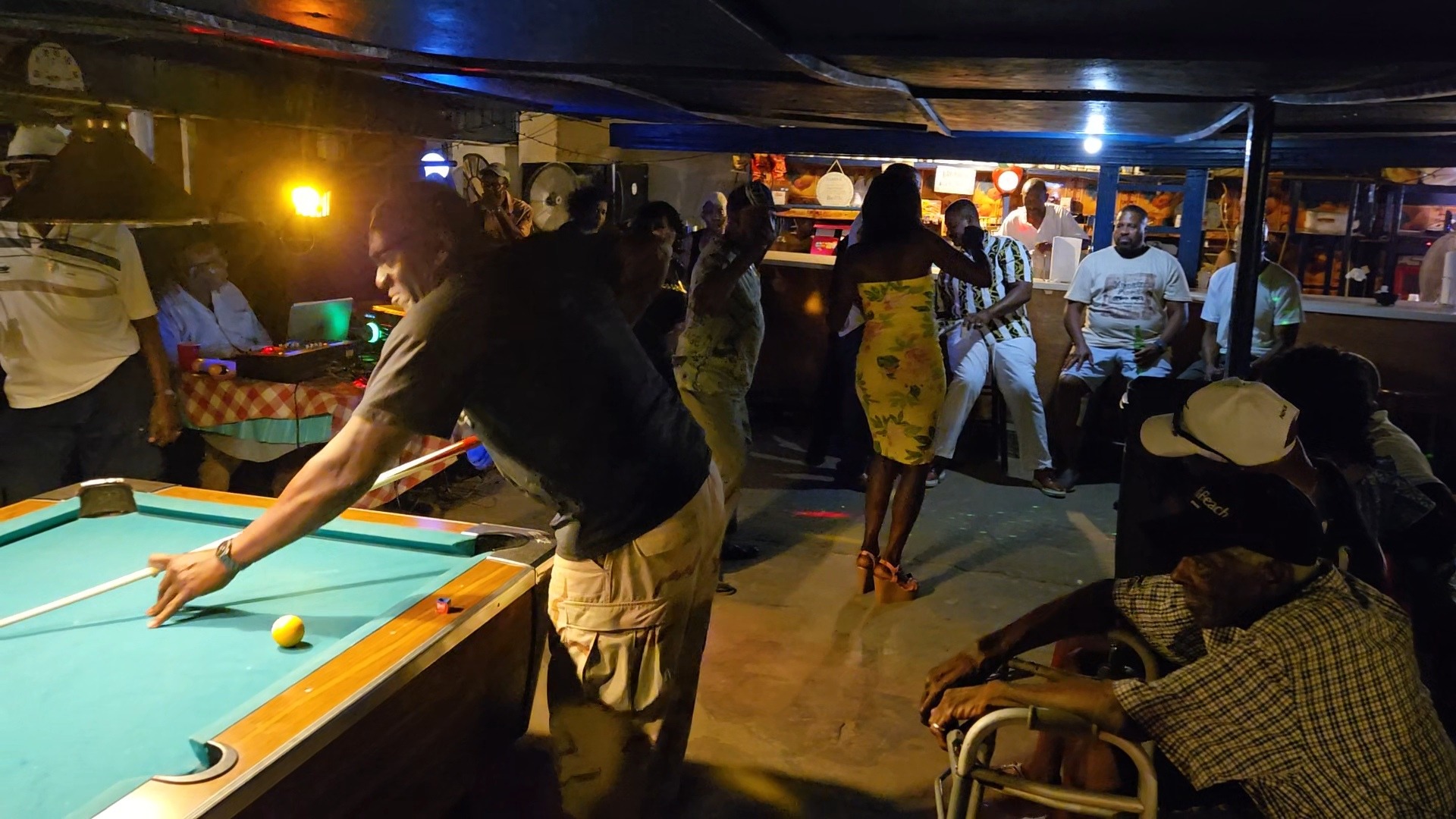 Family enjoying pool, dancing, and laughter at night